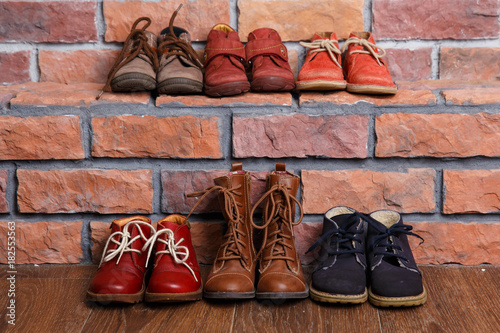 Christmas shoes near and on a brick wall