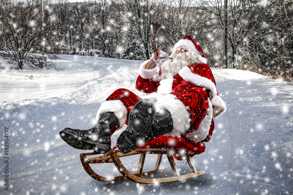 Santa Claus and winter road of snow 