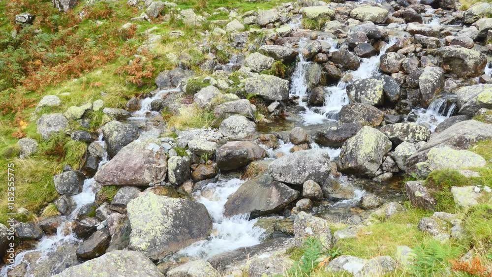 A mountain stream on the rocks. England. A mountain stream on the rocks. England.