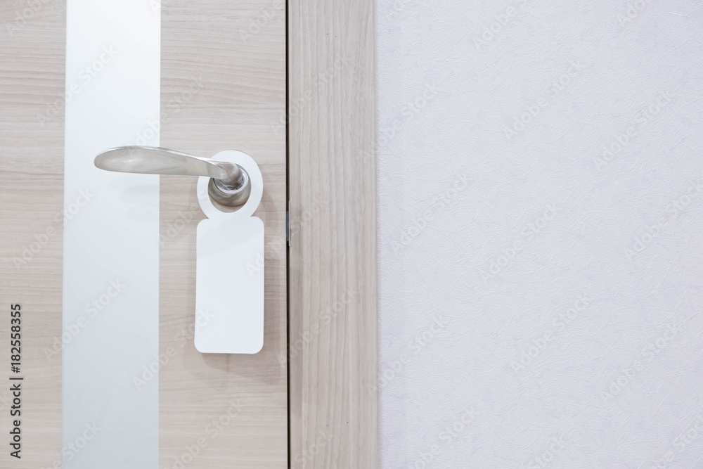 Empty label on a door handle for your text. door do not disturb sign.