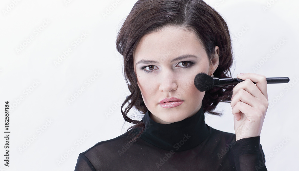 stylish young woman with brush for makeup stylish young woman with brush for makeup