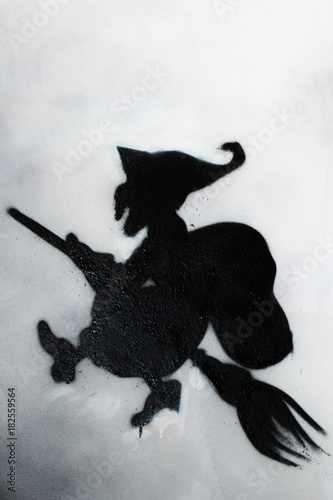 Witch Fly on the Broom and Moon in background  Befana Grafito on Public Wall  Street Art Graffiti  Halloween Theme