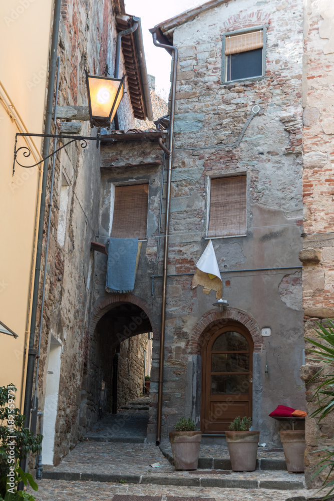 Antique Italian Architecture: House with Stone Facade, Lamp and Stone Flooring