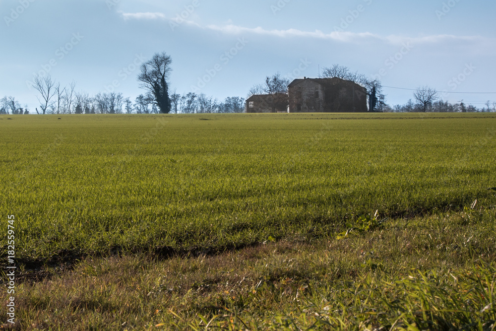 Isolated Farmhouse, Green Meadow, Trees in Countryside and Blue Isolated Farmhouse, Green Meadow, Trees in Countryside and Blue