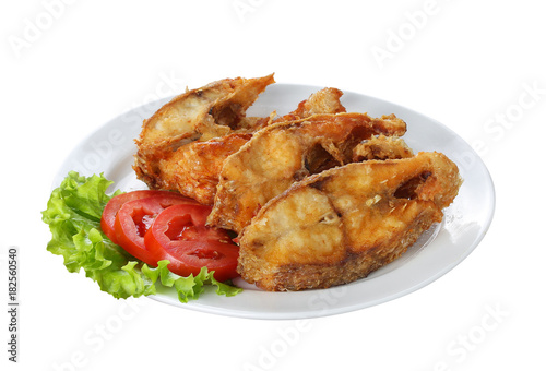 fried fish with vegetable on white