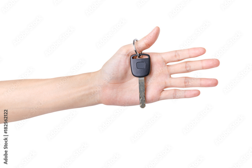 Hand holding car key isolated on white background Hand holding car key isolated on white background