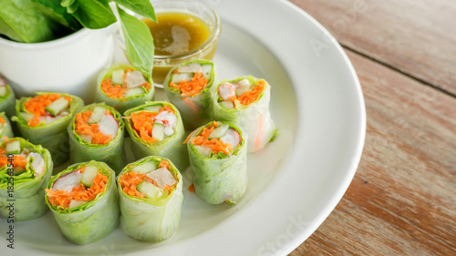 Fresh spring rolls with assorted vegetables with spicy sauce.