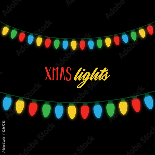 Christmas colorful lights on string. Shining xmas lights on black background with writing. Colorful light bulbs vector graphic illustration.