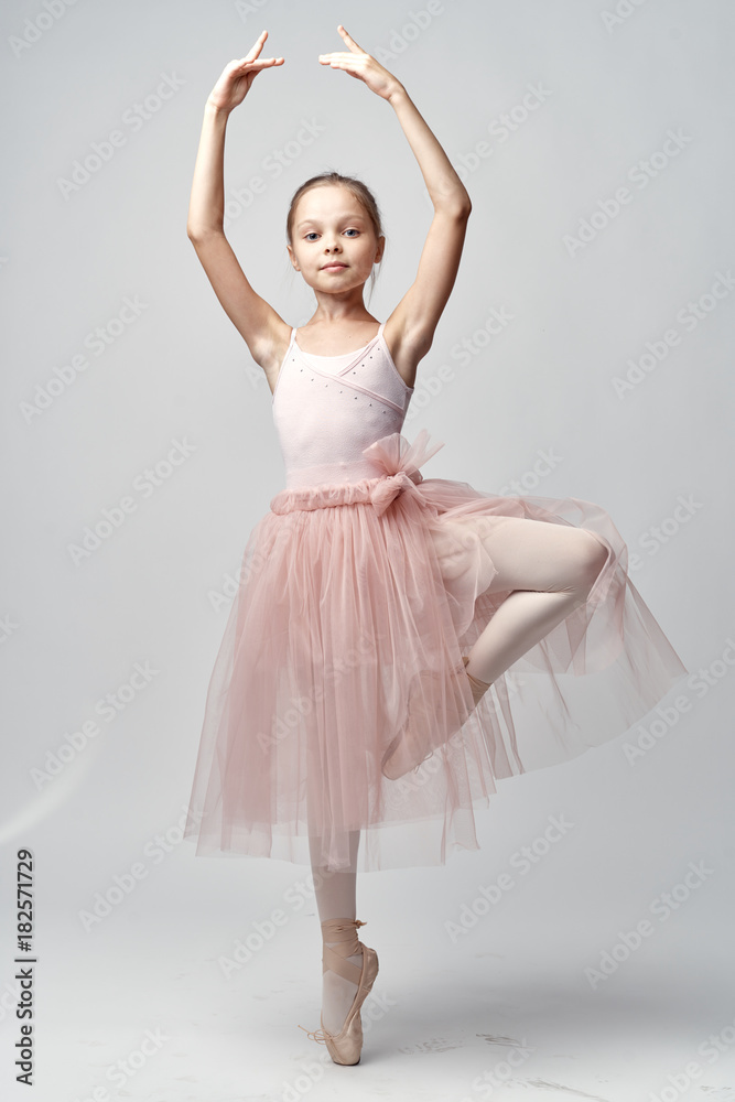 ballerina in the rack, child, gray background ballerina in the rack, child, gray background