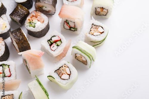 Set of sushi, maki and rolls on white background