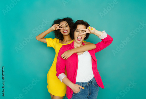 Two girlfriends having fun at azur studio background photo