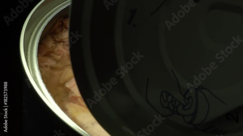 Open tuna can with lid in rotation