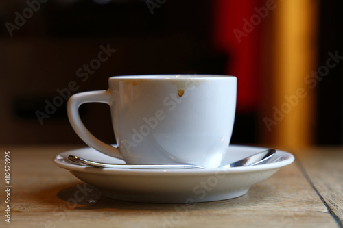 Close up white cup of black coffee on table