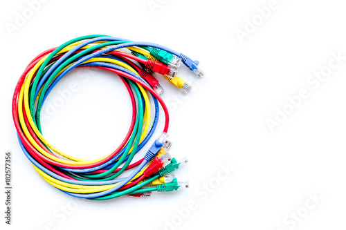 Colored patch-cord on white background top view copyspace
