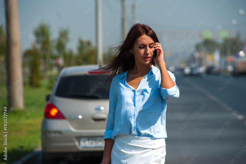 Frustrated young woman having problem with car Frustrated young woman having problem with car