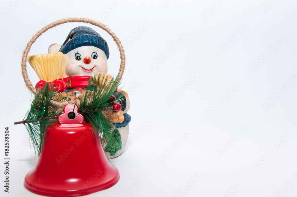 Christmas snowman decoration with red bells, isolated on white background.