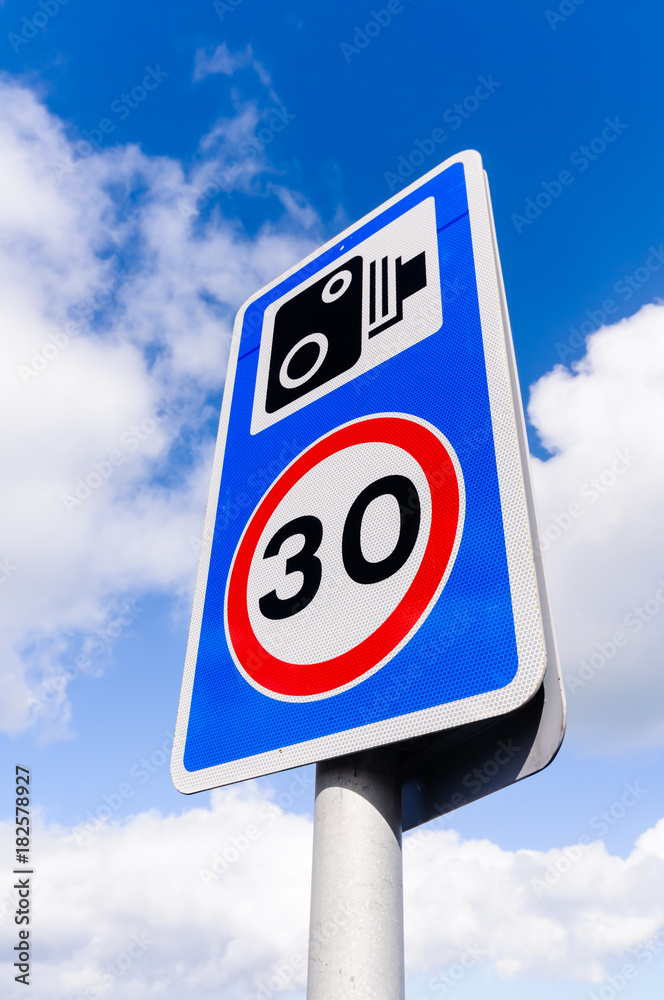 30mph speed limit sign with a speed camera warning 30mph speed limit sign with a speed camera warning