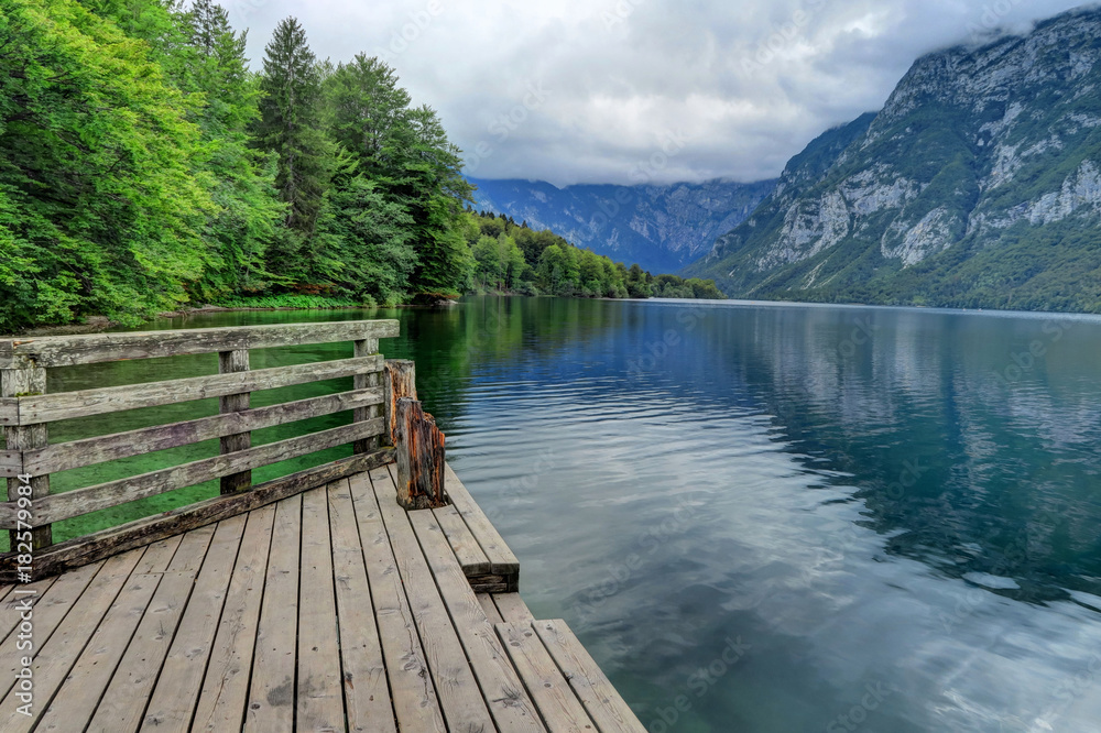 Wooden platform leading to Lake Bohinj in Slovenia Wooden platform leading to Lake Bohinj in Slovenia