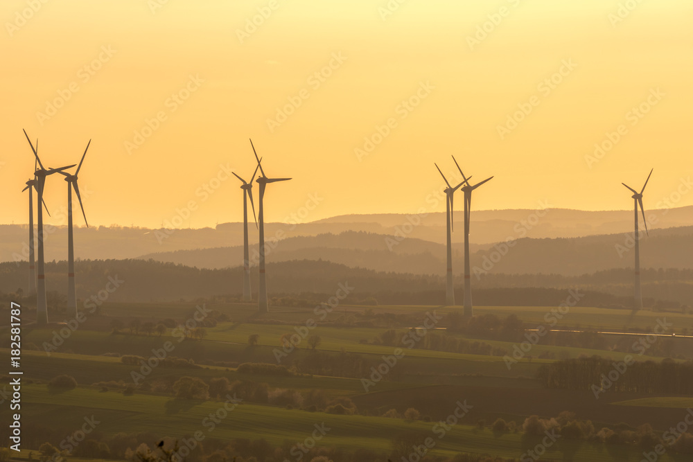 Obraz premium Landscape with Wind turbine in sundown