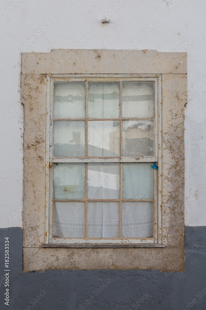 Closed old window with a reflection Closed old window with a reflection
