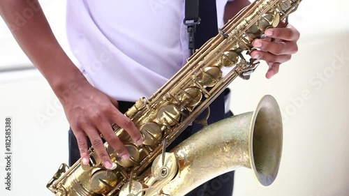 Student playing saxophone in college.
