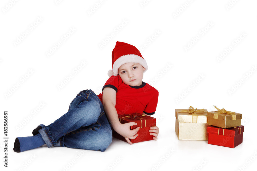 Cute Santa baby on white background with gifts Cute Santa baby on white background with gifts