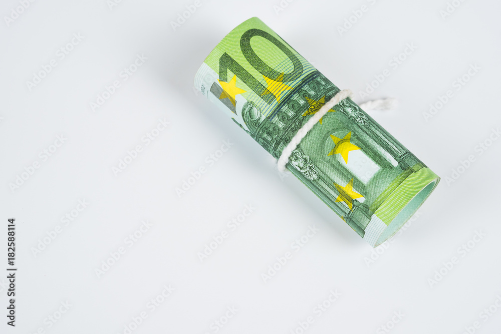 Roll of one hundred euro banknotes with robe isolated on white background. Roll of one hundred euro banknotes with robe isolated on white background.
