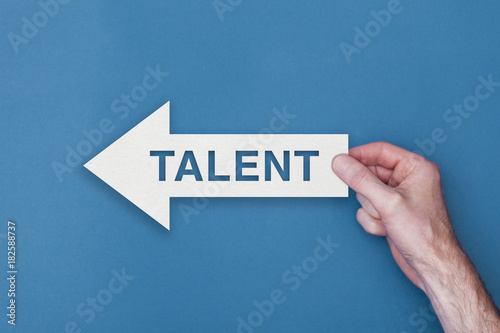Talent arrow direction held on a blue background