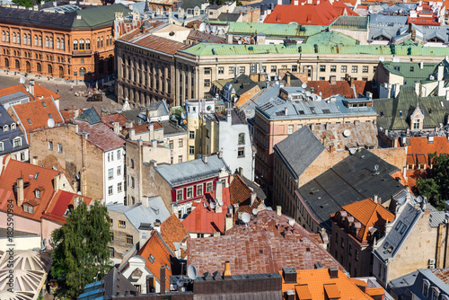 top view of rusty and red tile roofs, Riga, Latvia