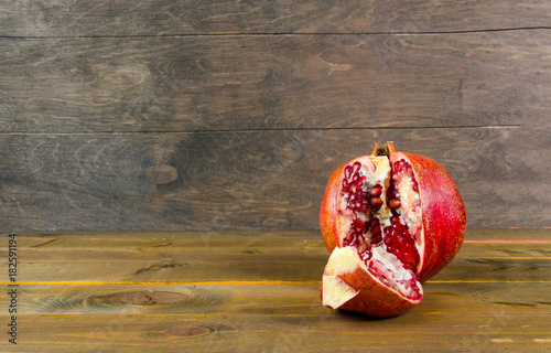 pomegranate on sacking and wooden background