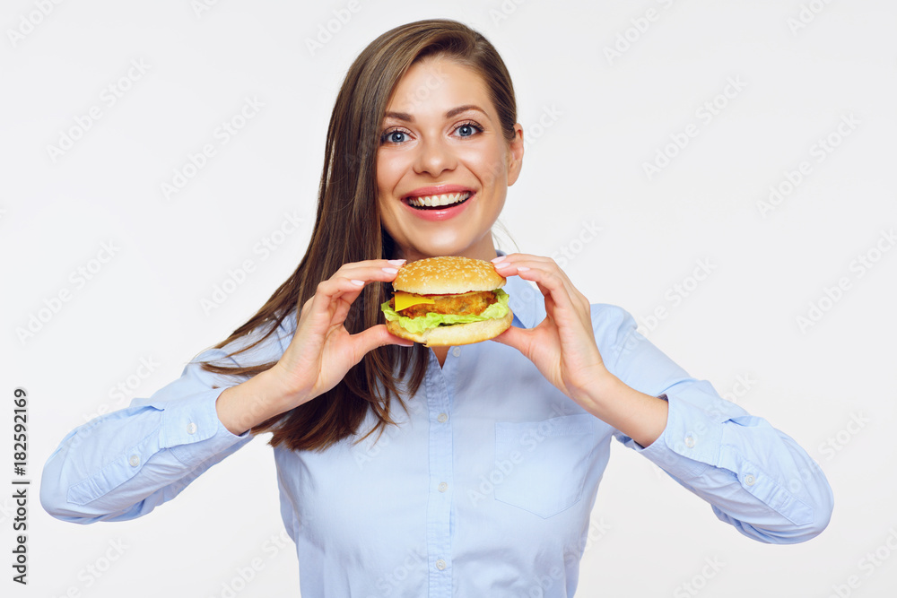 Smiling woman holding burger. Isolated portrait Smiling woman holding burger. Isolated portrait