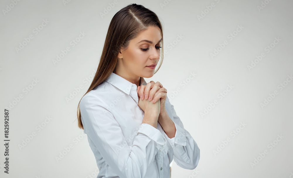 Praying woman portrait on white isolated background. Praying woman portrait on white isolated background.