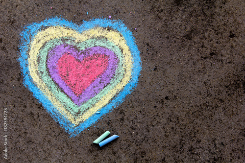 chalk drawing: colorful hearts on asphalt