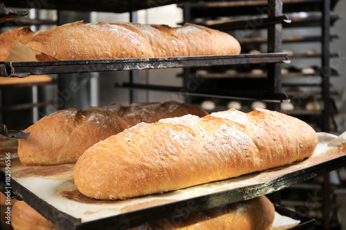 Loaves of bread on shelving in bakery