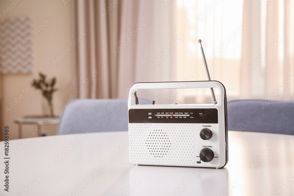 Fototapeta premium Retro style radio on table indoors