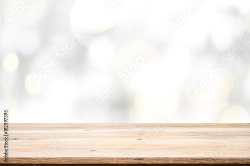 Wood table top on white bokeh abstract background