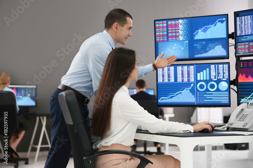 Stock traders working in office