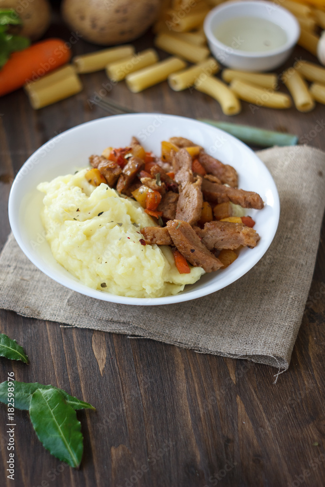 Soy meat with potato puree over kitchen table. Soy meat with potato puree over kitchen table.