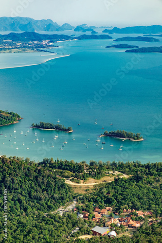 View of blue sky, sea and mountain seen from Cable Car viewpoint, Langkawi, Malaysia. Picturesque landscape with town among the tropical forest, beaches, small Islands in waters of Strait of Malacca © sonatalitravel