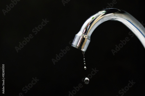 crane on a black background with a drop
