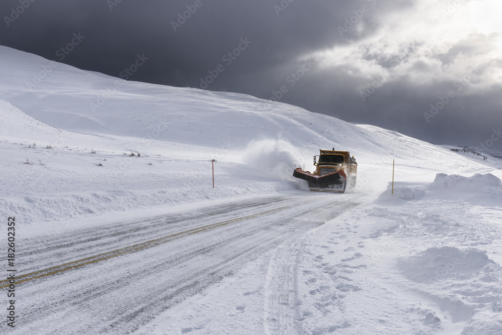 Snow Plow Clearing Roads during Snowstorm Snow Plow Clearing Roads during Snowstorm