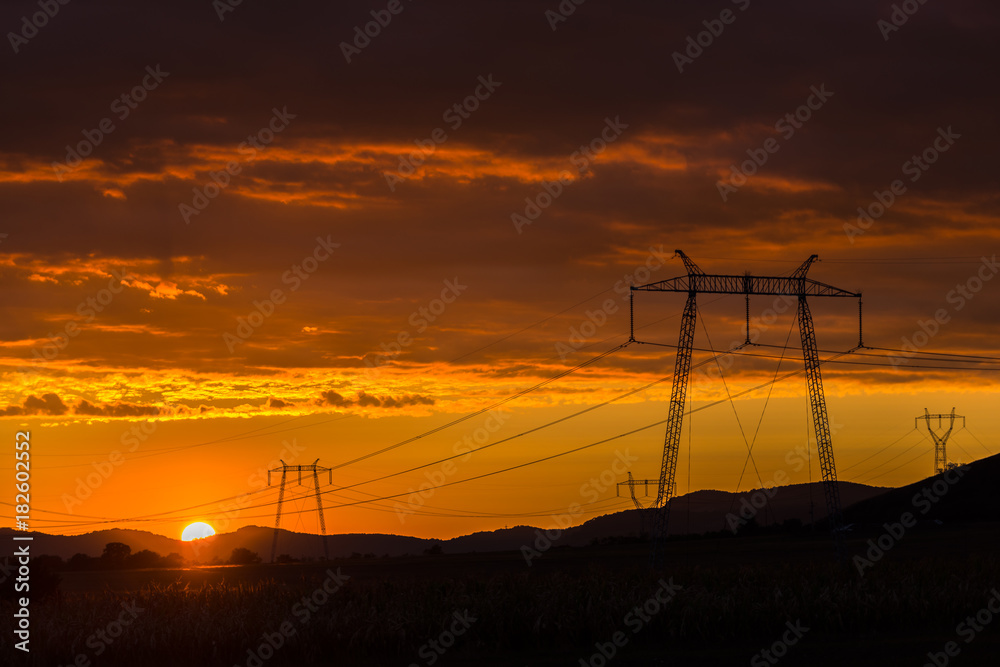 Fototapeta premium Sunset clouds and electric pylon