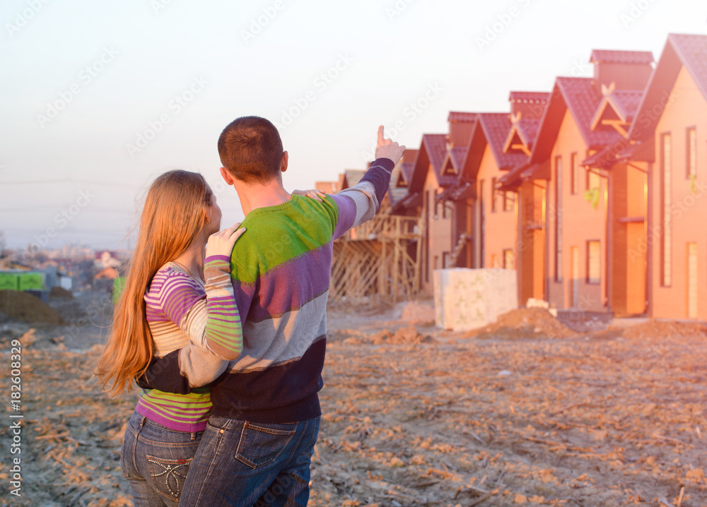loving couple looking at their home.
