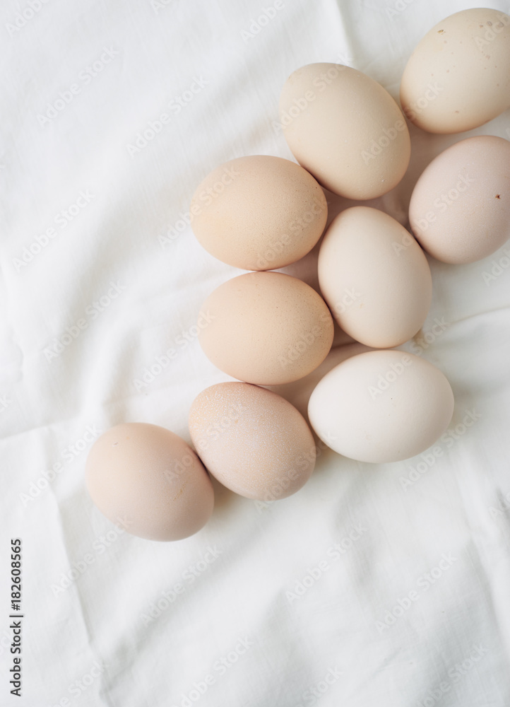 Fresh raw eggs in white background top view Fresh raw eggs in white background top view
