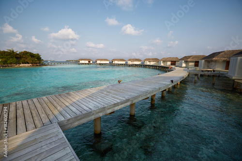 Water bungalows in hotel on Maldives. Villas on Indian ocean at luxury spa resort. © artiemedvedev