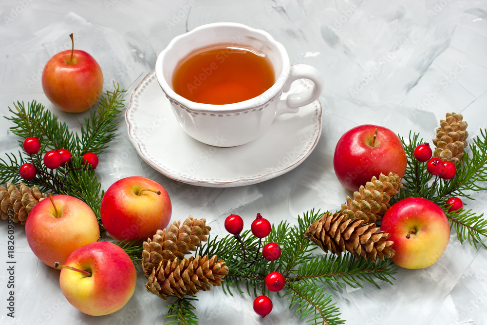 Christmas composition with tea cup and holiday decoration Christmas composition with tea cup and holiday decoration