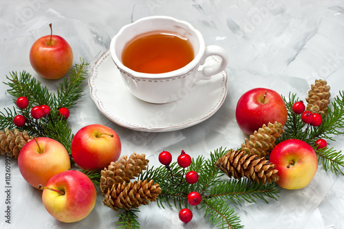 Christmas composition with tea cup and holiday decoration
