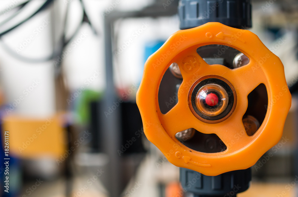 Orange ball valve on the plant chemical system Orange ball valve on the plant chemical system