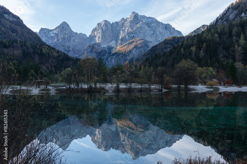 The majestic Julian Alps reflecting in the Jasna Lake at Kranjska Gora