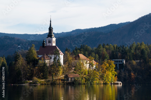 The beautiful Bled island and its church basking in the late evening sunshine